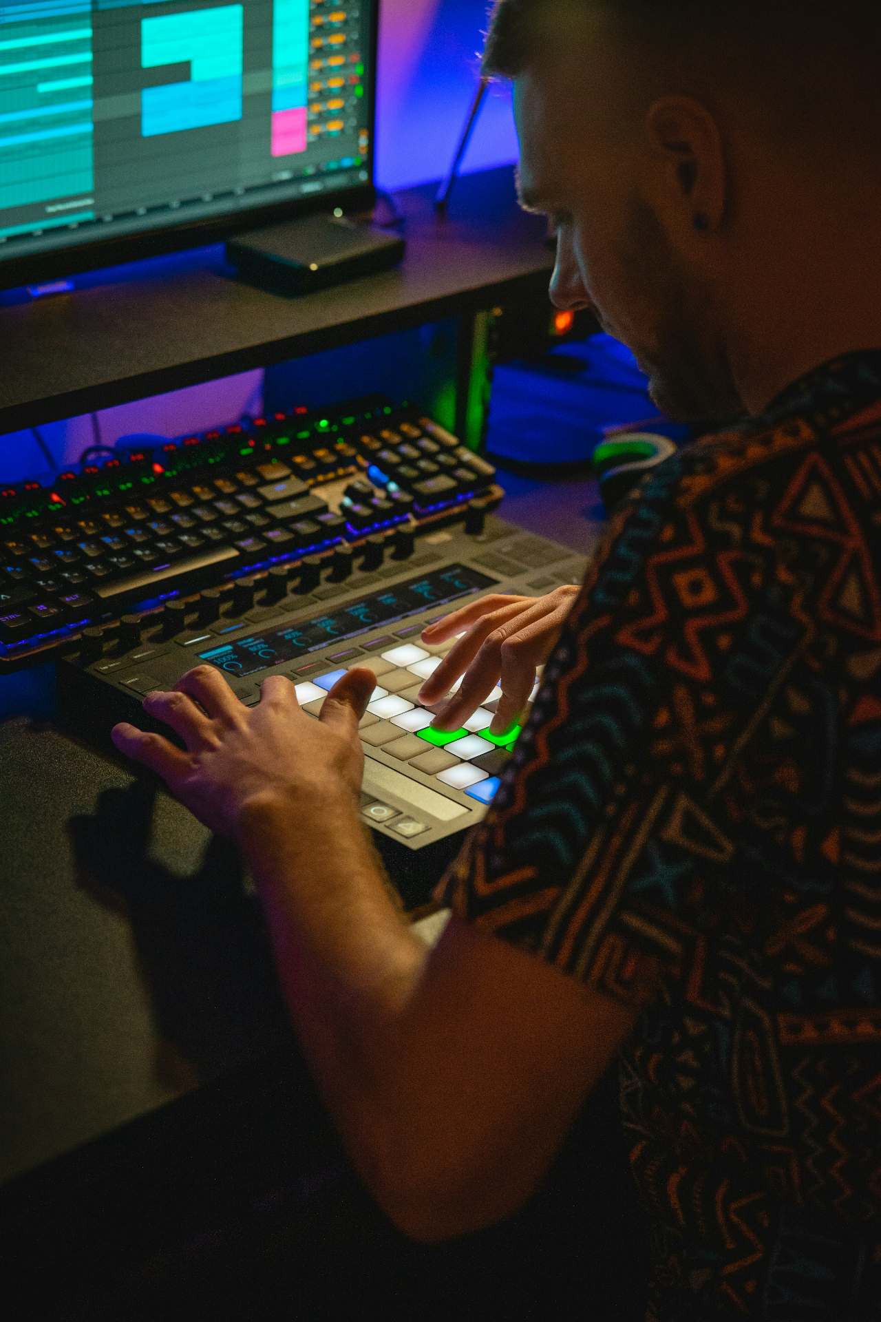 Producer in red-lit studio